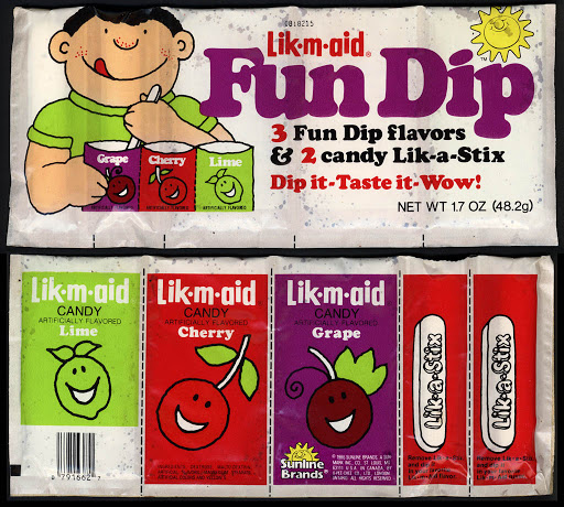 A Lik-m-aid Fun Dip wrapper with grape, cherry and lime packets and two Lik-a-Stix